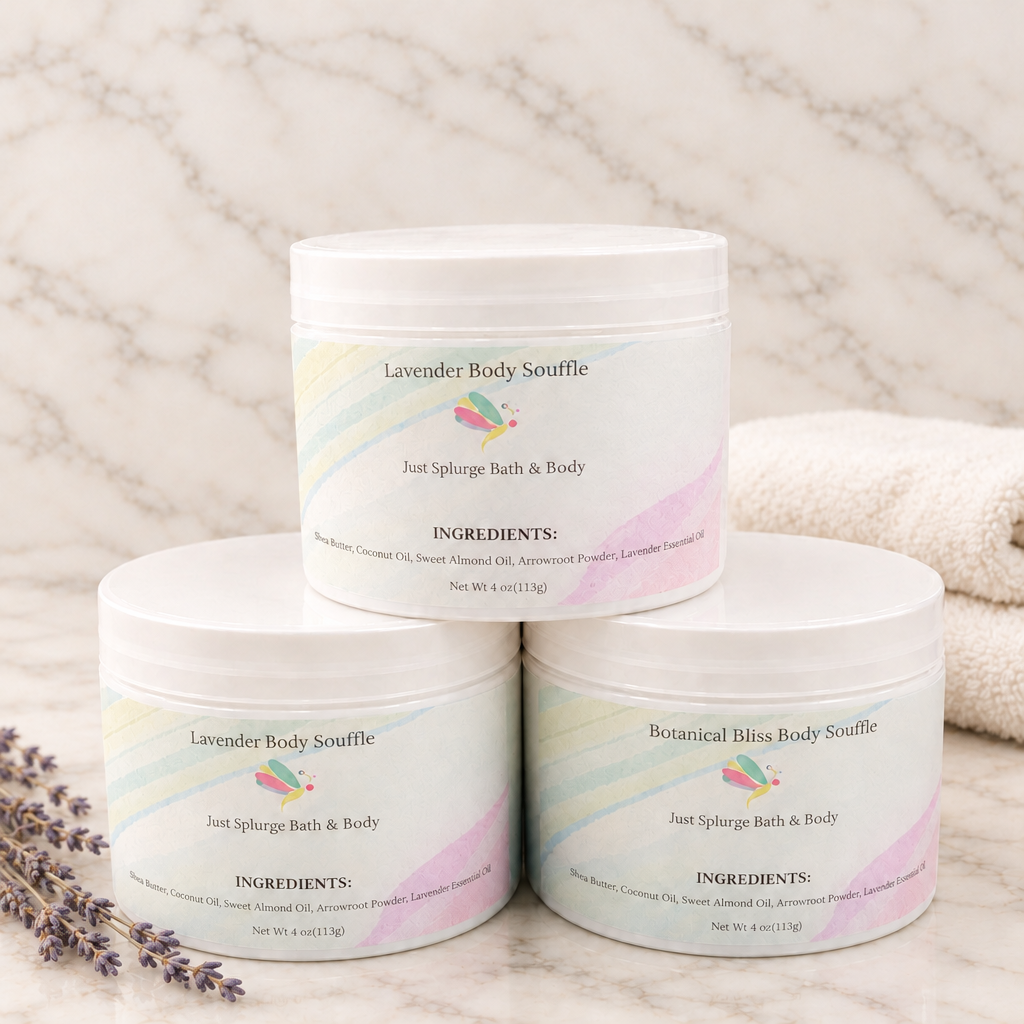 Three white Body Souffle jars stacked on warm marble with lavender stems and a folded ivory towel.